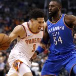 Phoenix Suns guard Devin Booker (1) drives against Oklahoma City Thunder forward Patrick Patterson (54) during the second half of an NBA basketball game Friday, March 2, 2018, in Phoenix. The Thunder won 124-116. (AP Photo/Matt York)