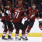 Arizona Coyotes defenseman Oliver Ekman-Larsson (23) celebrates his goal against the Ottawa Senators with center Derek Stepan (21) and left wing Brendan Perlini, left, during the first period of an NHL hockey game Saturday, March 3, 2018, in Glendale, Ariz. (AP Photo/Ross D. Franklin)