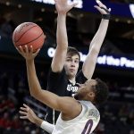 Colorado's Tyler Bey, left, covers a shot from Arizona's Parker Jackson-Cartwright during the first half of an NCAA college basketball game in the quarterfinals of the Pac-12 men's tournament Thursday, March 8, 2018, in Las Vegas. (AP Photo/Isaac Brekken)