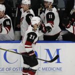Arizona Coyotes forward Derek Stepan (21) is congratulated after scoring against the Buffalo Sabres during the first period of an NHL hockey game Wednesday, March 21, 2018, in Buffalo, N.Y. (AP Photo/Jeffrey T. Barnes)