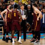 Loyola-Chicago head coach Porter Moser talks to his players during a timeout in the first half in the semifinals of the Final Four NCAA college basketball tournament against Michigan , Saturday, March 31, 2018, in San Antonio. (AP Photo/Brynn Anderson)