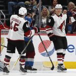 Arizona Coyotes center Christian Dvorak, right, celebrates scoring a goal with right wing Josh Archibald, left, as Colorado Avalanche defenseman Samuel Girard looks on in the first period of an NHL hockey game Saturday, March 10, 2018, in Denver. (AP Photo/David Zalubowski)