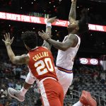 Phoenix Suns guard Elfrid Payton, right, shoots as Atlanta Hawks forward John Collins (20) defends during the first half of an NBA basketball game Sunday, March 4, 2018, in Atlanta. (AP Photo/John Amis)