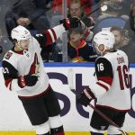 Arizona Coyotes Dylan Strome (20) and Max Domi (16) celebrate a goal during the first period of the team's NHL hockey game against the Buffalo Sabres on Wednesday, March 21, 2018, in Buffalo, N.Y. (AP Photo/Jeffrey T. Barnes)