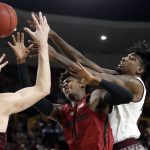 Arizona State forward Romello White, right, and Stanford guard Daejon Davis (1) battle for the ball during the first half of an NCAA college basketball game Saturday, March 3, 2018, in Tempe, Ariz. (AP Photo/Matt York)