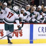 Minnesota Wild left wing Marcus Foligno (17) celebrates his goal against the Arizona Coyotes with teammates on the bench during the third period of an NHL hockey game Saturday, March 17, 2018, in Glendale, Ariz. The Wild defeated the Coyotes 3-1. (AP Photo/Ross D. Franklin)