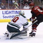 Arizona Coyotes center Clayton Keller, right, beats Minnesota Wild goaltender Devan Dubnyk, left, for a goal during the second period of an NHL hockey game Saturday, March 17, 2018, in Glendale, Ariz. (AP Photo/Ross D. Franklin)
