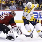Arizona Coyotes goaltender Darcy Kuemper, left, makes a save on a shot by Nashville Predators center Colton Sissons (10) as Coyotes defenseman Alex Goligoski (33) watches during the first period of an NHL hockey game Thursday, March 15, 2018, in Glendale, Ariz. (AP Photo/Ross D. Franklin)