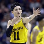 UMBC's K.J. Maura (11) celebrates after a basket against Virginia during the first half of a first-round game in the NCAA men's college basketball tournament in Charlotte, N.C., Friday, March 16, 2018. (AP Photo/Gerry Broome)