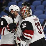 Arizona Coyotes' Jordan Martinook (48) and goalie Antti Raanta (32) celebrate the team's 4-1 victory over the Buffalo Sabres in an NHL hockey game Wednesday, March 21, 2018, in Buffalo, N.Y. (AP Photo/Jeffrey T. Barnes)