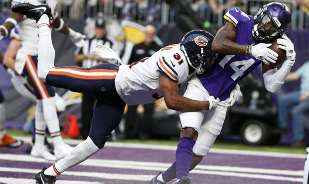 Minnesota Vikings wide receiver Stefon Diggs (14) catches a 15-yard touchdown pass over Chicago Bea...