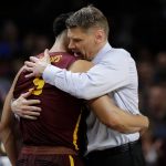 Loyola-Chicago head coach Porter Moser hugs Marques Townes (5) during the second half in the semifinals of the Final Four NCAA college basketball tournament against Michigan, Saturday, March 31, 2018, in San Antonio. (AP Photo/David J. Phillip)