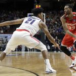 Ohio State forward Keita Bates-Diop, right, looks to pass around the defense of Gonzaga forward Rui Hachimura (21) during the first half of a second-round game in the NCAA men's college basketball tournament Saturday, March 17, 2018, in Boise, Idaho. (AP Photo/Otto Kitsinger)