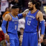 Oklahoma City Thunder center Steven Adams (12) embraces guard Russell Westbrook (0) after Westbrook was fouled during the second half of an NBA basketball game against the Phoenix Suns Friday, March 2, 2018, in Phoenix. The Thunder won 124-116. (AP Photo/Matt York)