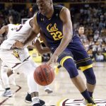 California center Kingsley Okoroh (22) spins around Arizona State forward De'Quon Lake during the first half of an NCAA college basketball game Thursday, March 1, 2018, in Tempe, Ariz. (AP Photo/Matt York)