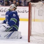 Vancouver Canucks goaltender Jacob Markstrom reacts after giving up a goal to Arizona Coyotes center Clayton Keller during the first period of an NHL hockey game Wednesday, March 7, 2018, in Vancouver, British Columbia. (Jonathan Hayward/The Canadian Press via AP)