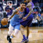 LA Clippers guard Austin Rivers (25) slips past Phoenix Suns guard Tyler Ulis during the first half of an NBA basketball game Wednesday, March 28, 2018, in Phoenix. (AP Photo/Matt York)