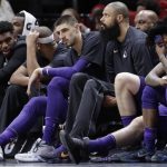 Phoenix Suns' Alex Len, third from left, Tyson Chandler and Elfrid Payton, right, sit on the bench during the second half of an NBA basketball game against the Miami Heat, Monday, March 5, 2018, in Miami. (AP Photo/Lynne Sladky)