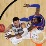 Villanova's Jalen Brunson (1) shoots over Kansas's Lagerald Vick (2) during the second half in the semifinals of the Final Four NCAA college basketball tournament, Saturday, March 31, 2018, in San Antonio. (AP Photo/David J. Phillip)