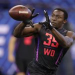 Oklahoma State wide receiver James Washington runs a drill at the NFL football scouting combine in Indianapolis, Saturday, March 3, 2018. (AP Photo/Michael Conroy)