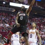 Houston Rockets guard James Harden (13) tries a reverse against the Phoenix Suns in the first half of an NBA basketball game Friday, March 30, 2018, in Houston. (AP Photo/George Bridges)
