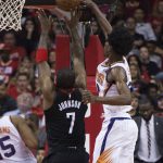Phoenix Suns guard Josh Jackson, right, blocks a shot by Houston Rockets guard Joe Johnson (7) in the second half of an NBA basketball game Friday, March 30, 2018, in Houston. (AP Photo/George Bridges)