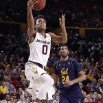 Arizona State guard Tra Holder (0) shoots as California forward Marcus Lee (24) watches during the second half of an NCAA college basketball game Thursday, March 1, 2018, in Tempe, Ariz. (AP Photo/Matt York)