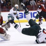 Minnesota Wild center Eric Staal, right, is upended in front of Arizona Coyotes goaltender Antti Raanta (32) during the first period of an NHL hockey game Thursday, March 1, 2018, in Glendale, Ariz. (AP Photo/Ross D. Franklin)