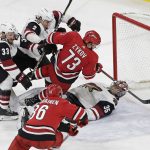 Carolina Hurricanes' Valentin Zykov (73), of Russia, scores against Arizona Coyotes goalie Darcy Kuemper (35) as Coyotes' Alex Goligoski (33) and Luke Schenn (2) defend during the third period of an NHL hockey game in Raleigh, N.C., Thursday, March 22, 2018. Carolina won 6-5. (AP Photo/Gerry Broome)