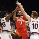 Syracuse's Oshae Brissett (11) drives against Arizona State's Romello White (23) and Vitaliy Shibel (10) during the second half of a First Four game of the NCAA men's college basketball tournament Wednesday, March 14, 2018, in Dayton, Ohio. Syracuse won 60-56. (AP Photo/John Minchillo)