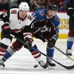 Arizona Coyotes center Nick Cousins, left, fights or control of the puck with Colorado Avalanche center Carl Soderberg in the third period of an NHL hockey game Saturday, March 10, 2018, in Denver. The Avalanche won 5-2. (AP Photo/David Zalubowski)