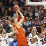 Syracuse's Marek Dolezaj (21) shoots next to Arizona State's Mickey Mitchell, left, and other defenders during the first half of a First Four game of the NCAA men's college basketball tournament Wednesday, March 14, 2018, in Dayton, Ohio. (AP Photo/John Minchillo)