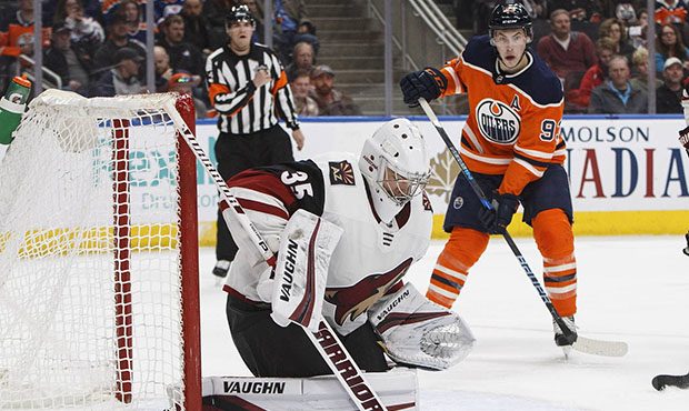 Arizona Coyotes goalie Darcy Kuemper (35) makes the save as Edmonton Oilers' Ryan Nugent-Hopkins (9...