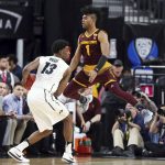 Arizona State's Remy Martin leaps as he defends against Colorado's Namon Wright during the first half of an NCAA college basketball game in the first round of the Pac-12 men's tournament Wednesday, March 7, 2018, in Las Vegas. (AP Photo/Isaac Brekken)