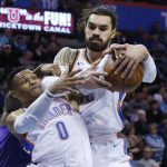 Oklahoma City Thunder's Russell Westbrook (0) and Steven Adams, right, reach for a rebound during the second half of the team's NBA basketball game against the Phoenix Suns in Oklahoma City, Thursday, March 8, 2018. (AP Photo/Sue Ogrocki)