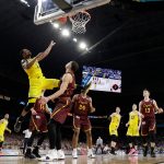Michigan's Charles Matthews (1) goes up for a basket during the second half in the semifinals of the Final Four NCAA college basketball tournament against Loyola-Chicago, Saturday, March 31, 2018, in San Antonio. (AP Photo/David J. Phillip)
