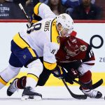 Nashville Predators center Kyle Turris (8) and Arizona Coyotes center Brad Richardson (15) vie for the puck after a faceoff during the second period of an NHL hockey game Thursday, March 15, 2018, in Glendale, Ariz. (AP Photo/Ross D. Franklin)