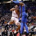 Phoenix Suns forward TJ Warren tries to shoot over Oklahoma City Thunder guard Russell Westbrook (0) during the second half of an NBA basketball game Friday, March 2, 2018, in Phoenix. The Thunder won 124-116. (AP Photo/Matt York)