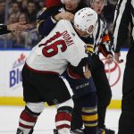 Buffalo Sabres Jordan Nolan (17) and Arizona Coyotes Max Domi (16) fight during the third period of an NHL hockey game Wednesday, March 21, 2018, in Buffalo, N.Y. (AP Photo/Jeffrey T. Barnes)