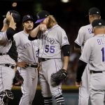 Colorado Rockies starting pitcher Jon Gray (55) is pulled from the baseball game by manager Bud Black (10) during the fifth inning against the Arizona Diamondbacks on Thursday, March 29, 2018, in Phoenix. (AP Photo/Matt York)