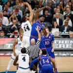 Villanova's Omari Spellman (14) and Kansas's Udoka Azubuike (35) battle for the ball at the tip off during the first half in the semifinals of the Final Four NCAA college basketball tournament, Saturday, March 31, 2018, in San Antonio. (AP Photo/Brynn Anderson)