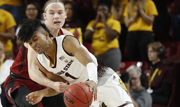 Arizona State guard Remy Martin (1) drives as Stanford guard Isaac White defends during the first h...