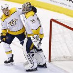 Nashville Predators goaltender Pekka Rinne (35) celebrates a win against the Arizona Coyotes with center Colton Sissons, left, at the end of an NHL hockey game Thursday, March 15, 2018, in Glendale, Ariz. The Predators defeated the Coyotes 3-2. (AP Photo/Ross D. Franklin)
