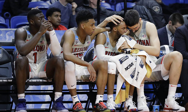 Arizona's Rawle Alkins, Allonzo Trier, Parker Jackson-Cartwright and Dusan Ristic, from left, react...