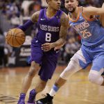 Phoenix Suns guard Tyler Ulis (8) drives past Los Clippers guard Austin Rivers (25) during the second half of an NBA basketball game Wednesday, March 28, 2018, in Phoenix. (AP Photo/Matt York)