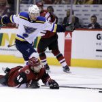 Arizona Coyotes left wing Jordan Martinook (48) is tripped by St. Louis Blues left wing Jaden Schwartz in the second period during an NHL hockey game, Saturday, March 31, 2018, in Glendale, Ariz. (AP Photo/Rick Scuteri)