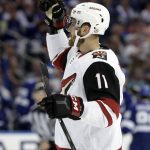 Arizona Coyotes left wing Brendan Perlini (11) celebrates his goal against the Tampa Bay Lightning during the third period of an NHL hockey game Monday, March 26, 2018, in Tampa, Fla. The Coyotes won the game 4-1. (AP Photo/Chris O'Meara)
