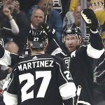 Los Angeles Kings center Jeff Carter (77) and teammates celebrate his third goal of the game against the Arizona Coyotes during an NHL hockey game in Los Angeles Thursday, March 29, 2018. The Kings won 4-2. (AP Photo/Reed Saxon)