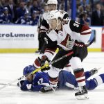 Arizona Coyotes right wing Christian Fischer (36) gets around Tampa Bay Lightning left wing Alex Killorn (17) as he breaks in on Lightning goaltender Louis Domingue during the first period of an NHL hockey game Monday, March 26, 2018, in Tampa, Fla. (AP Photo/Chris O'Meara)