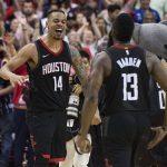 Houston Rockets guard Gerald Green (14) celebrates with James Harden (13) after hitting a shot at the buzzer to beat the Phoenix Suns in an NBA basketball game Friday, March 30, 2018, in Houston. (AP Photo/George Bridges)